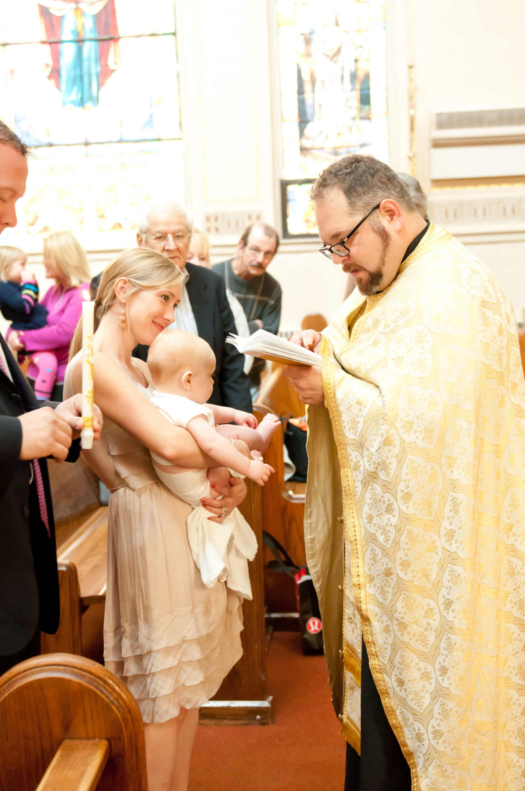 Priest Baptizing baby at Church in Minneapolis
