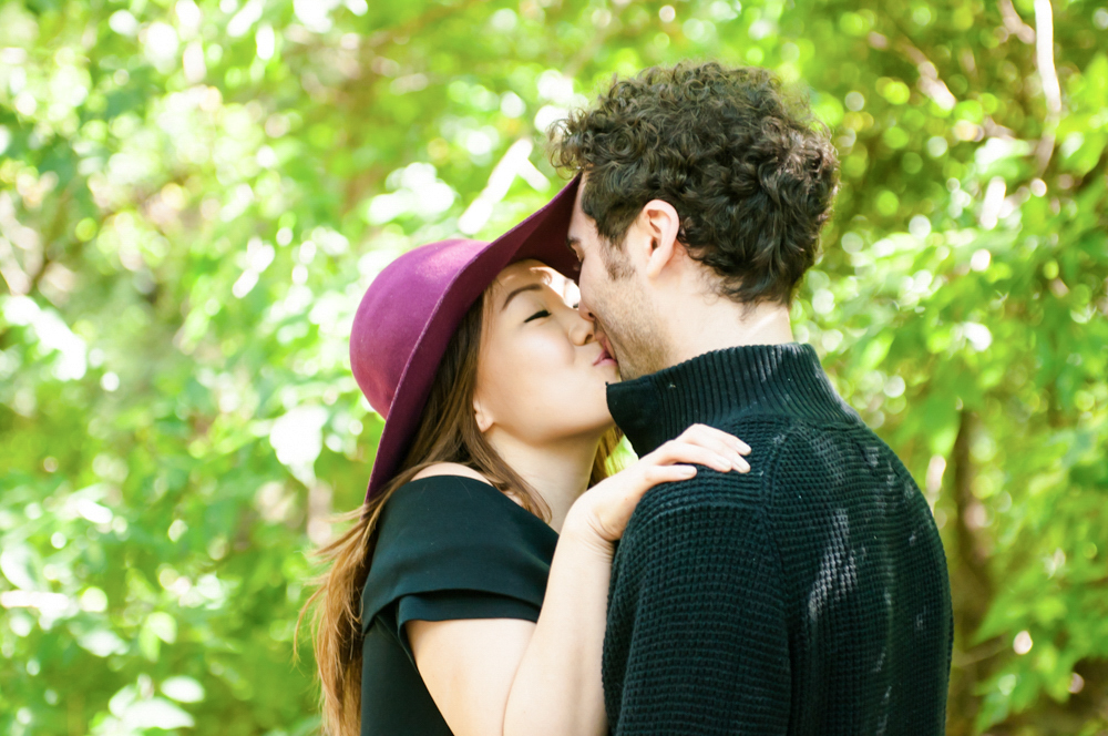 Couple kissing in woods 