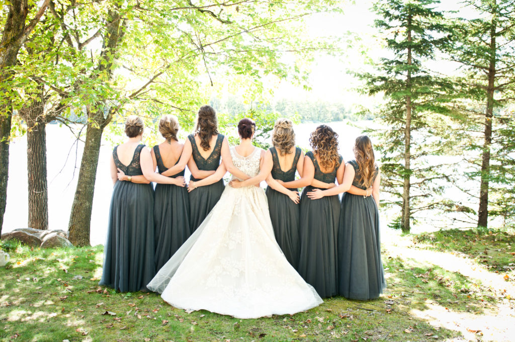 Bridal party holding hands at Minnesota wedding