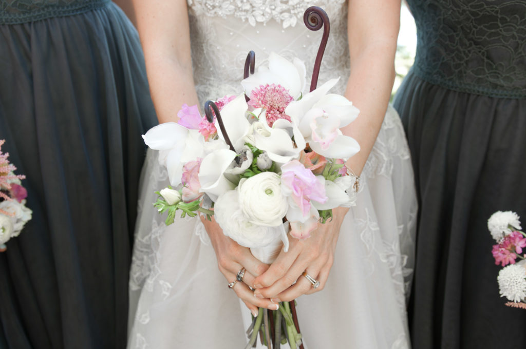 Bride holding bouquet at Maplelag Resort in Minnesota