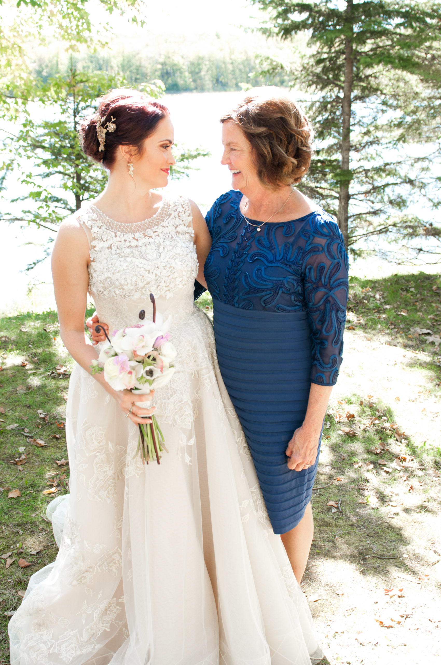 Bride smiling at mother in Minnesota wedding