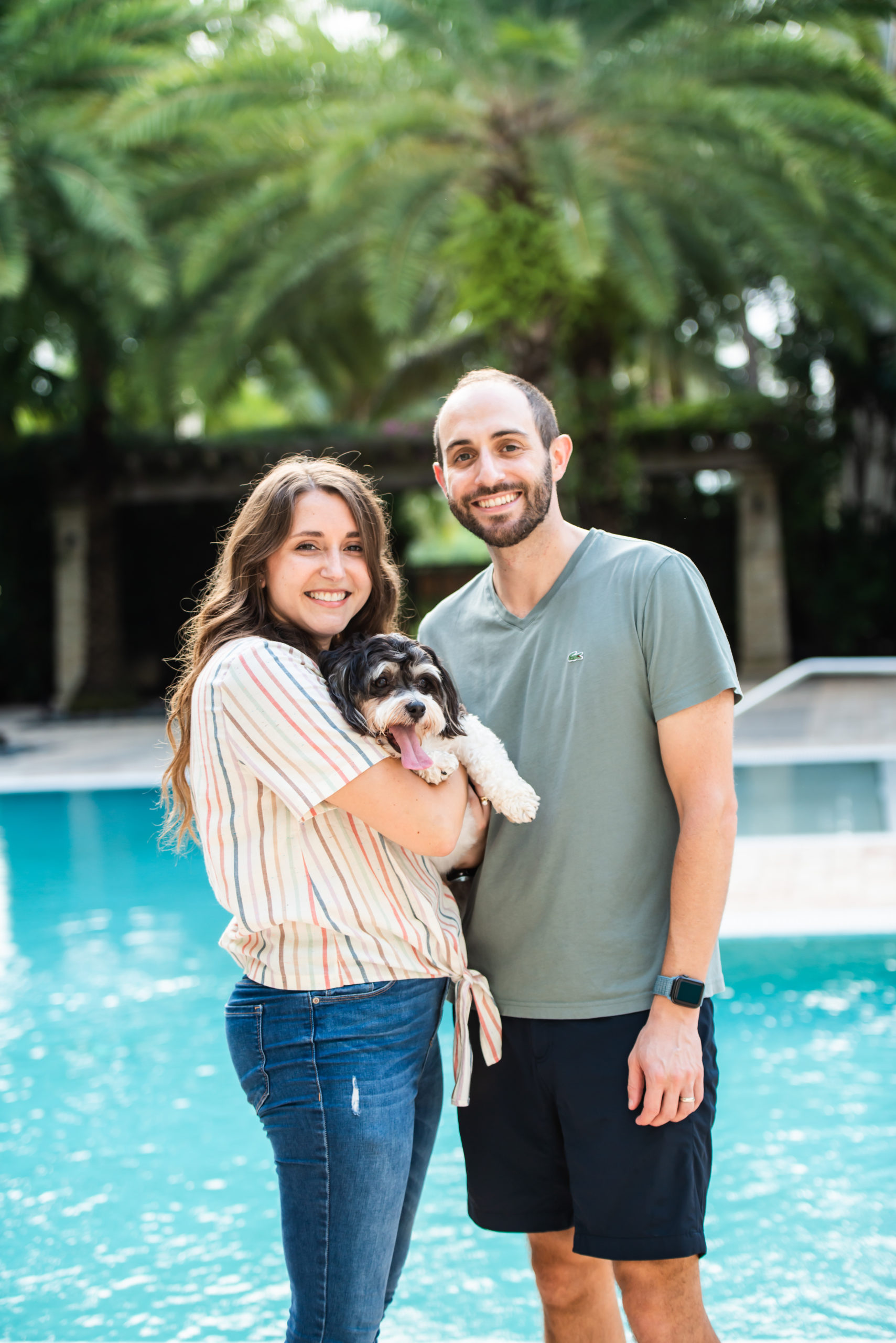 Couple posing with dog in Sunrise Florida