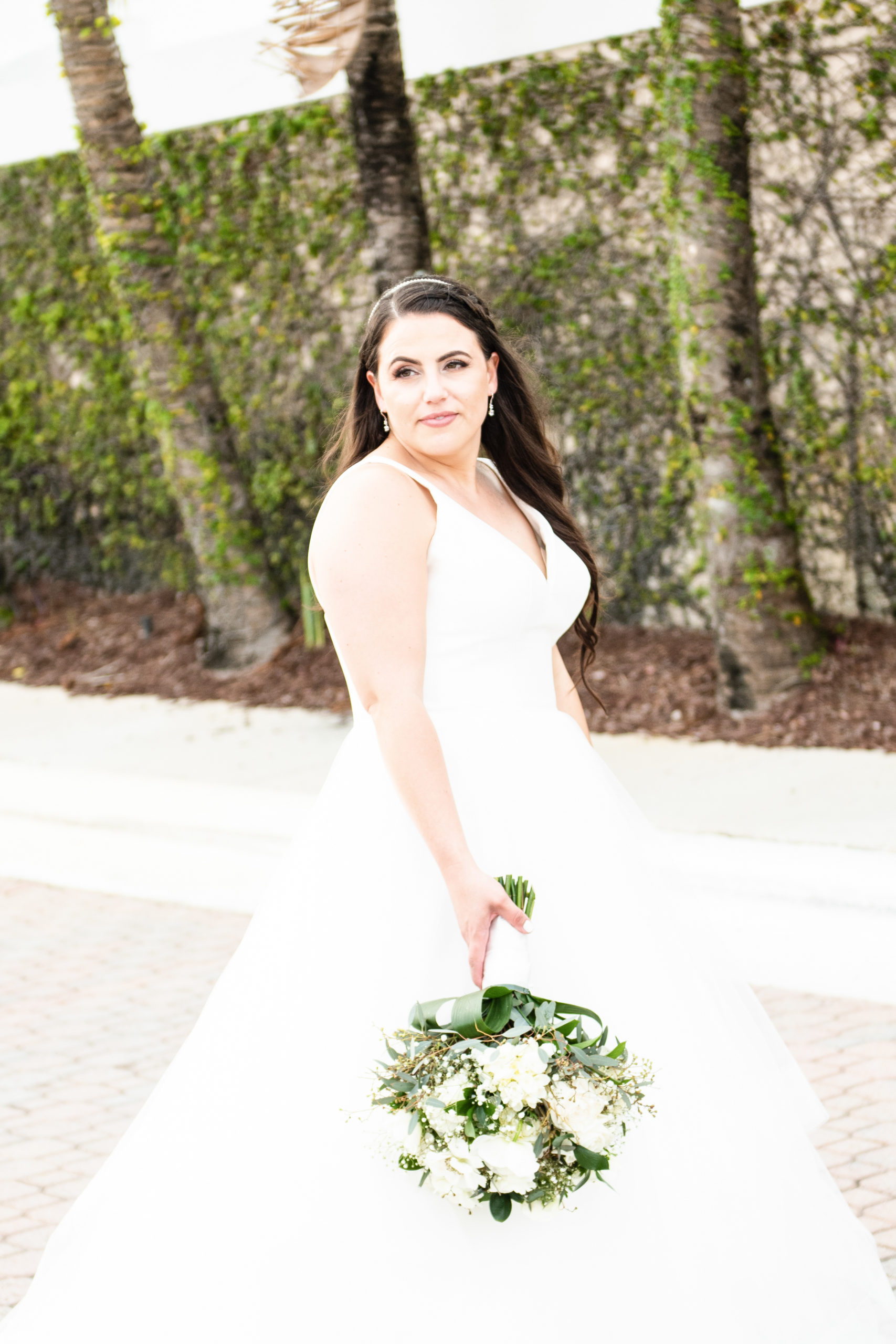 Bride posing in wedding gown