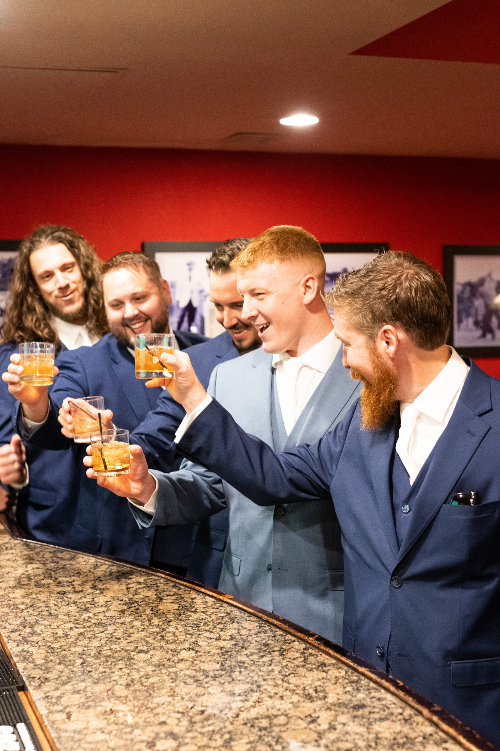 Groom and groomsmen raising a toast