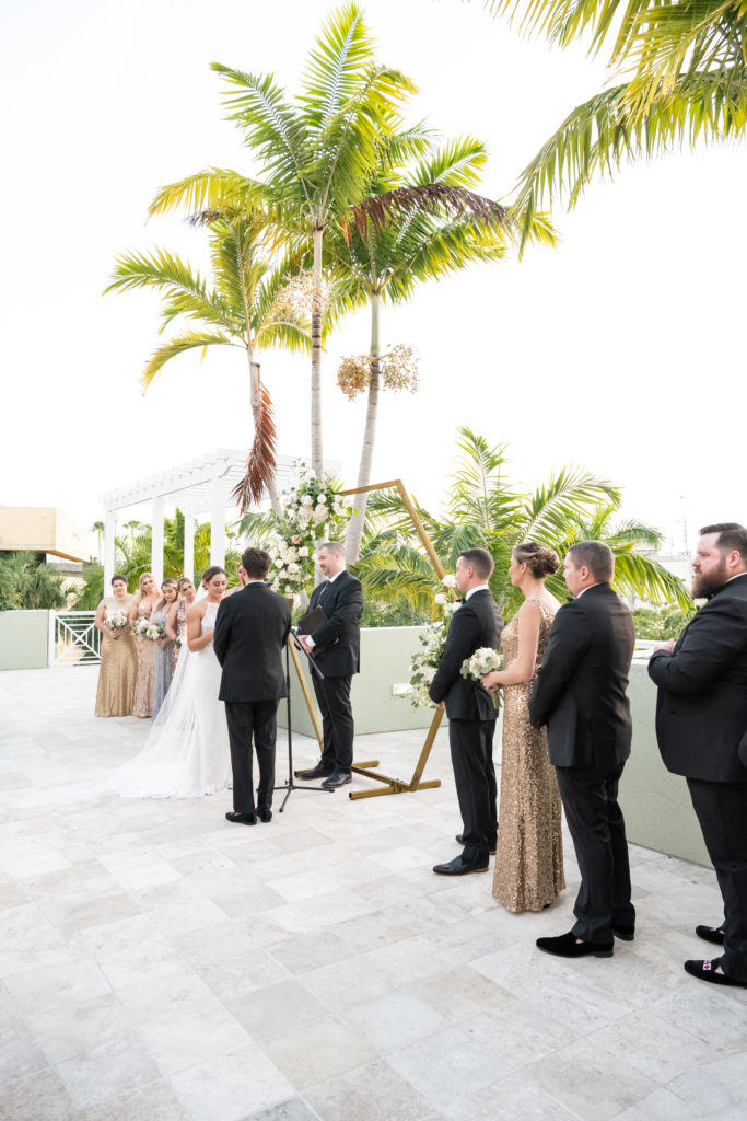 Bride and groom reading vows at wedding ceremony at Wyndham Grand in Jupiter 