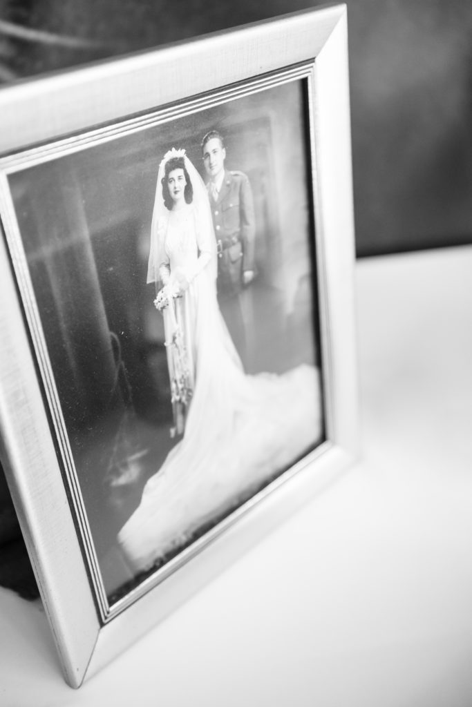 Framed photos of grandparents at wedding ceremony 
