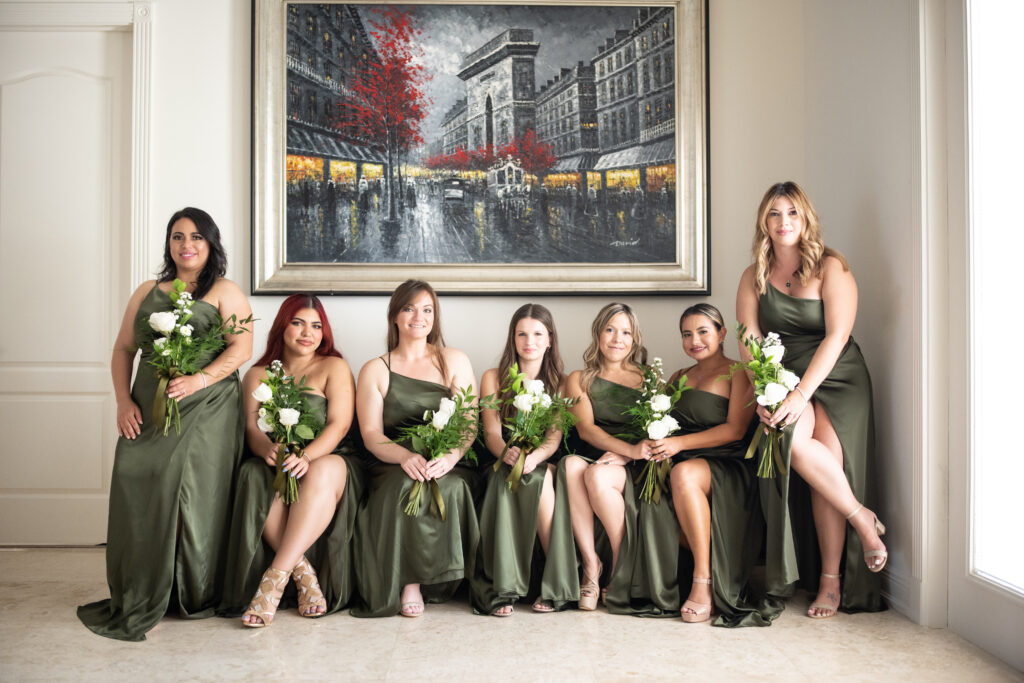 Bridesmaids in David Bridal's dresses posing with bridal bouquets 