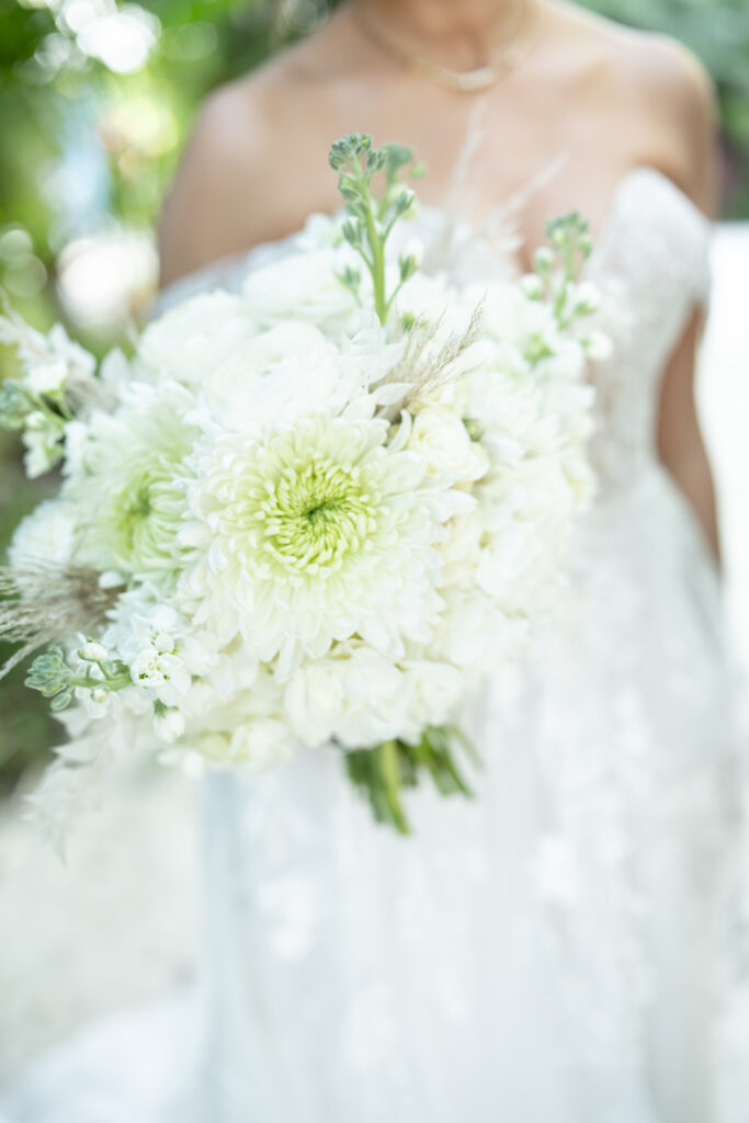 Bride holding wedding bouquet on florida keys beach 
