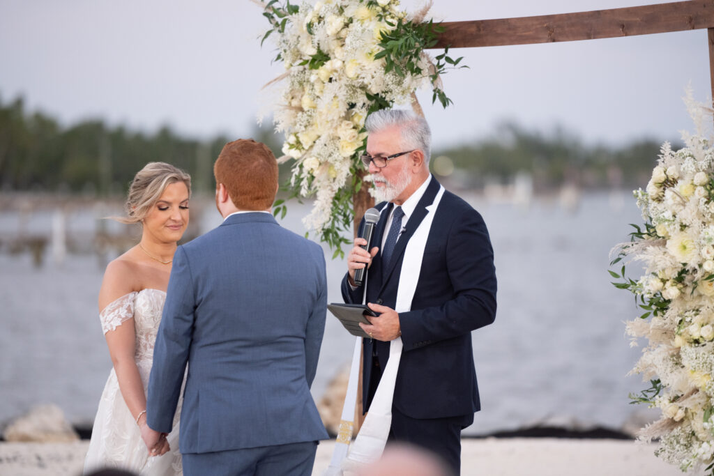 Bride and groom standing at wedding alter in Islamorada Florida 