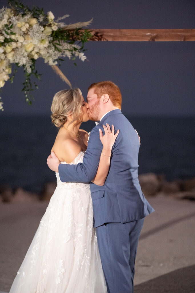 Bride and groom kissing at alter at Islander resort in Islamorada Florida 