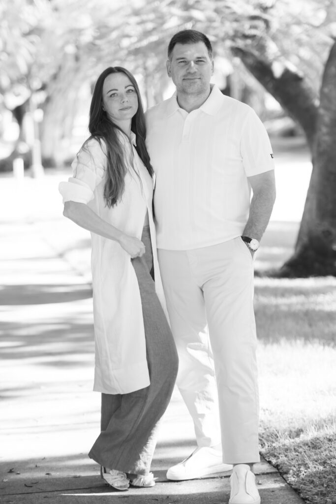 Couple posing in Naples, Florida, on 5th avenue during an engagement session